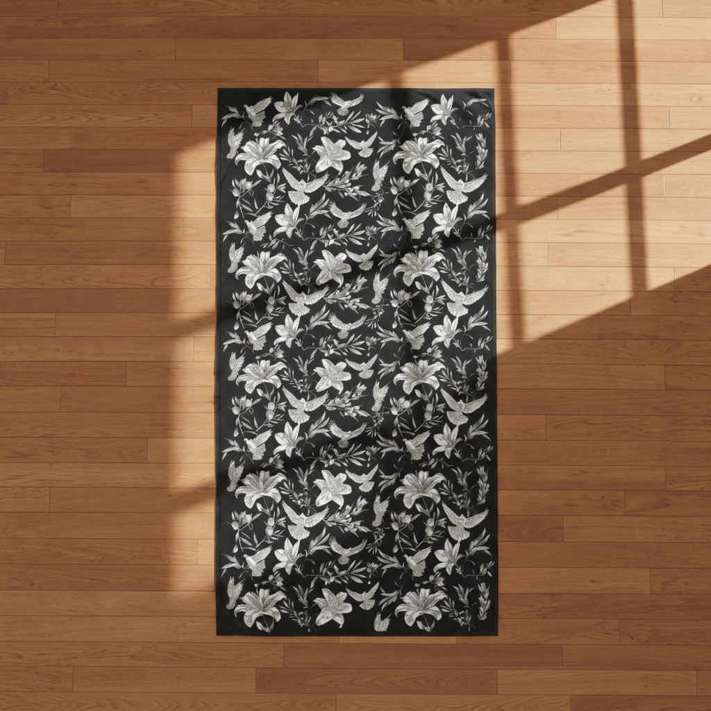 Floral and dove patterned fabric with black and white flowers on a black background