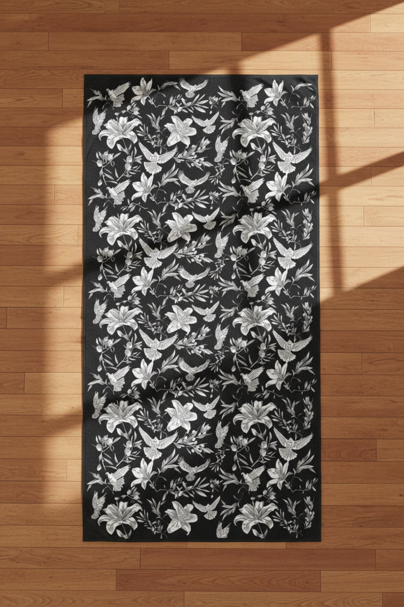 Floral and dove patterned fabric with black and white flowers on a black background