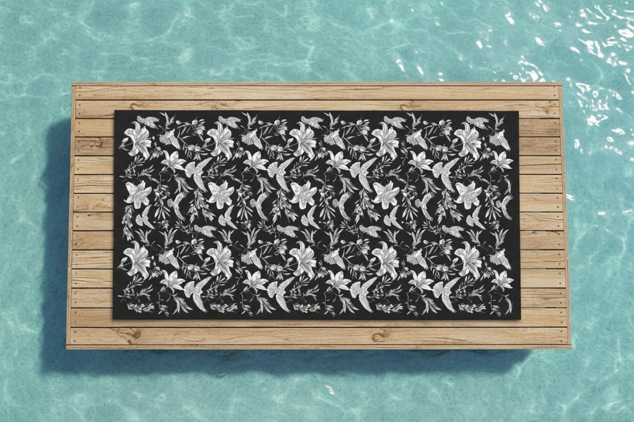 Floral and dove patterned towel with black background