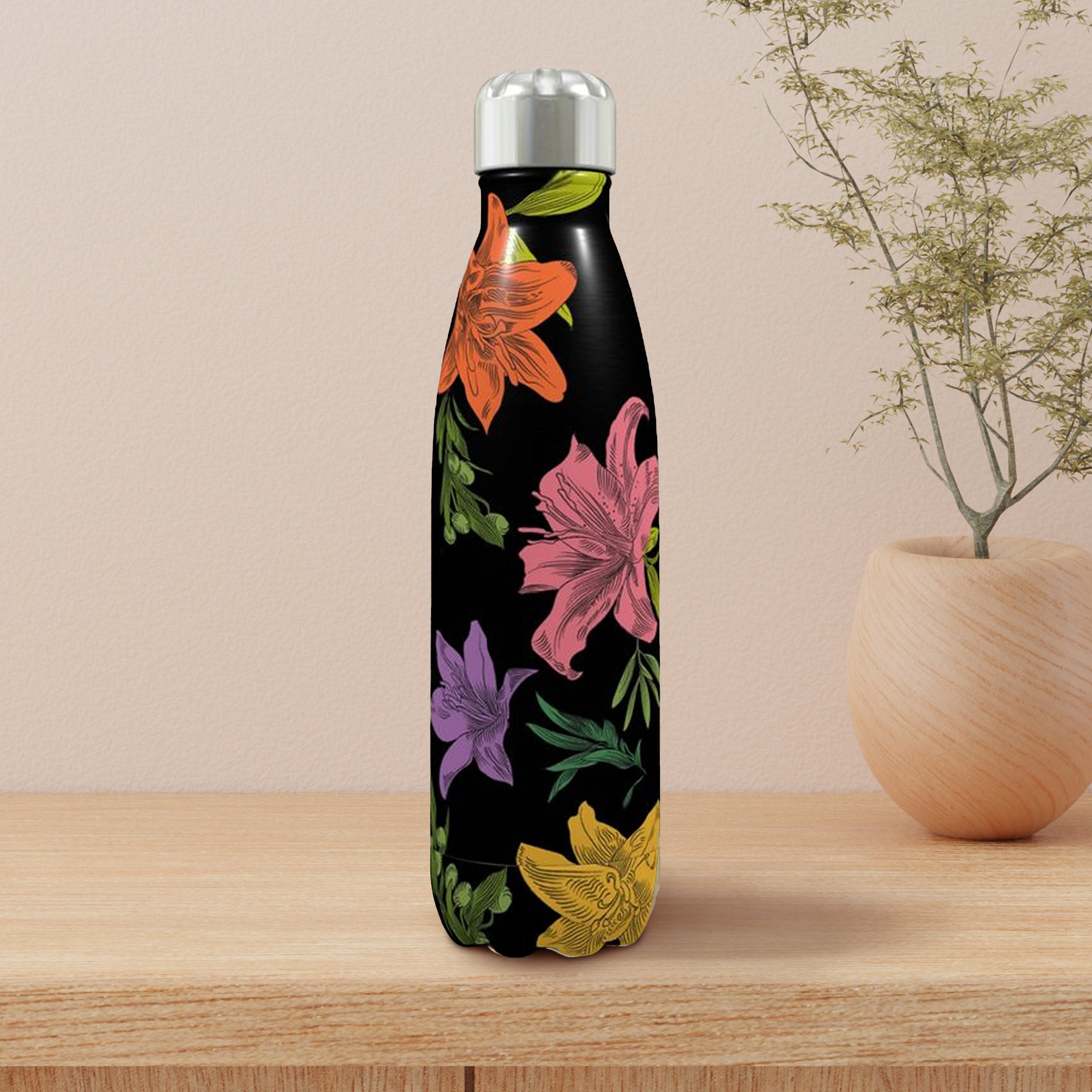 Floral-patterned water bottle on a wooden surface with a beige background