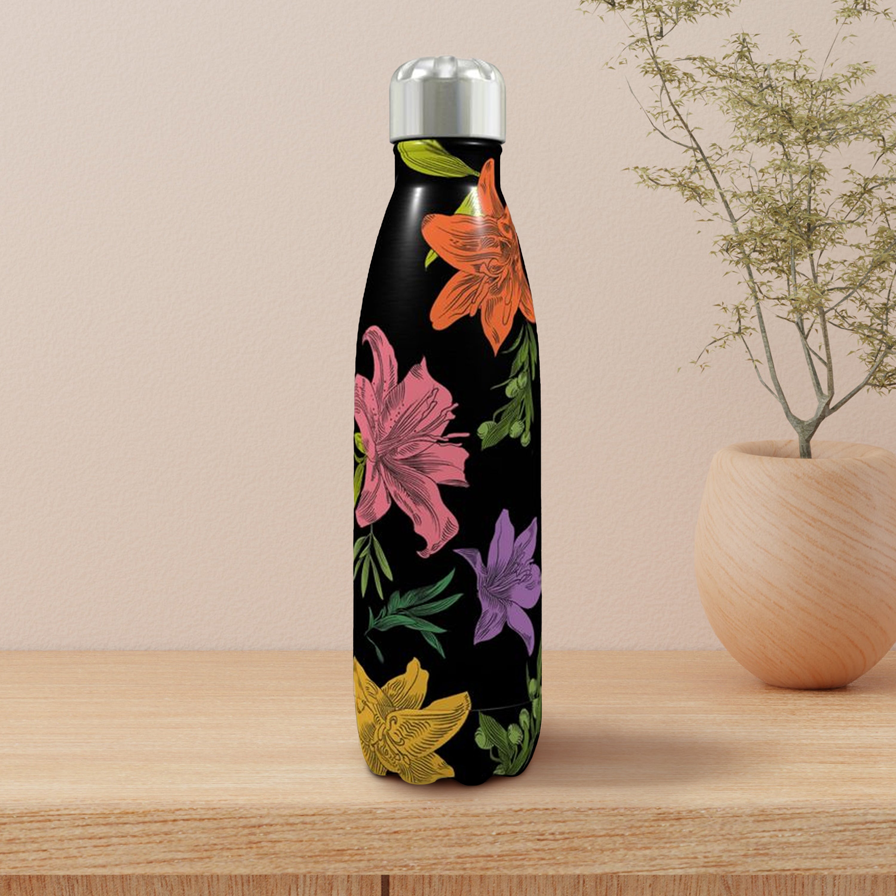 Floral-patterned water bottle on a wooden surface with a beige background