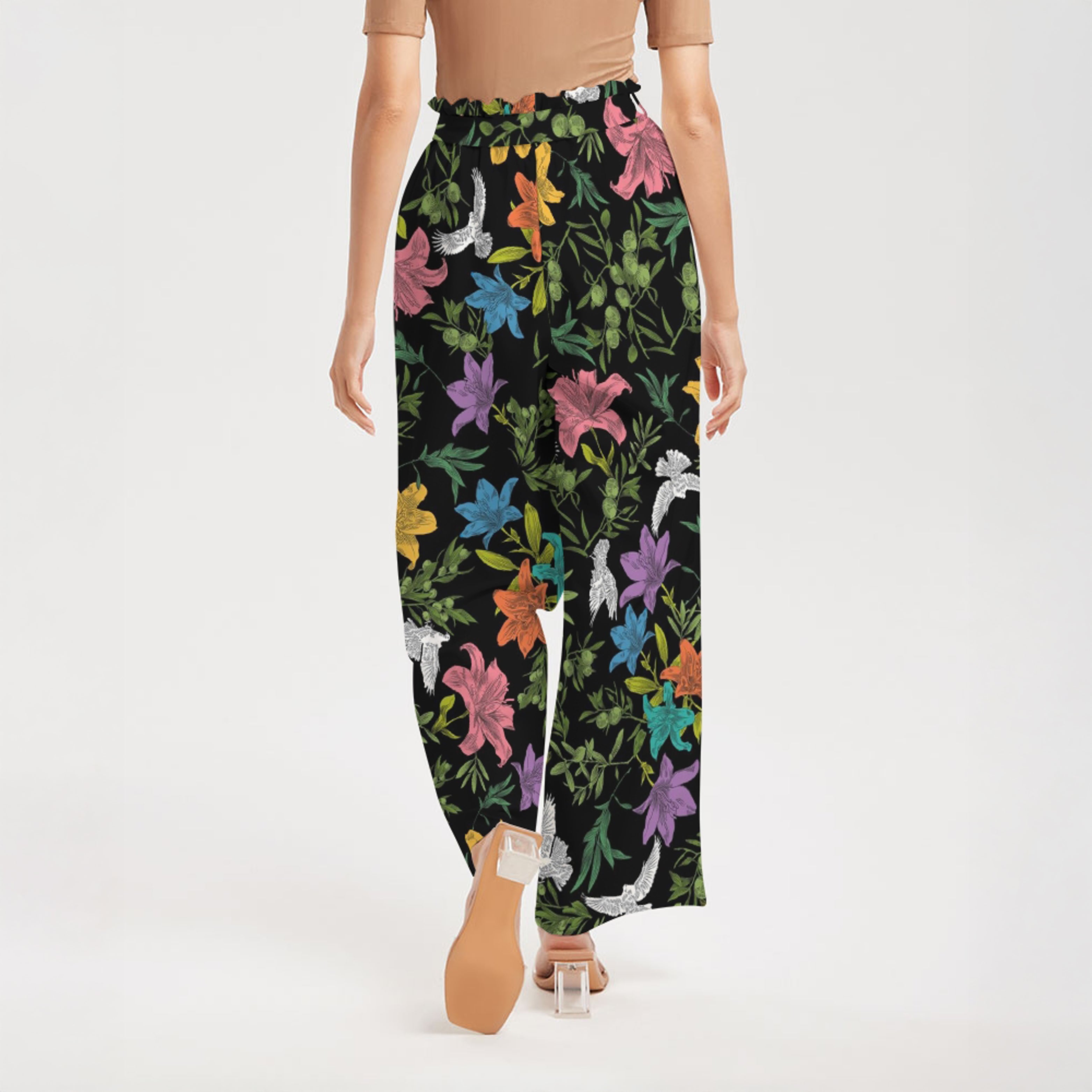 Floral-patterned pants worn by a person on a white background