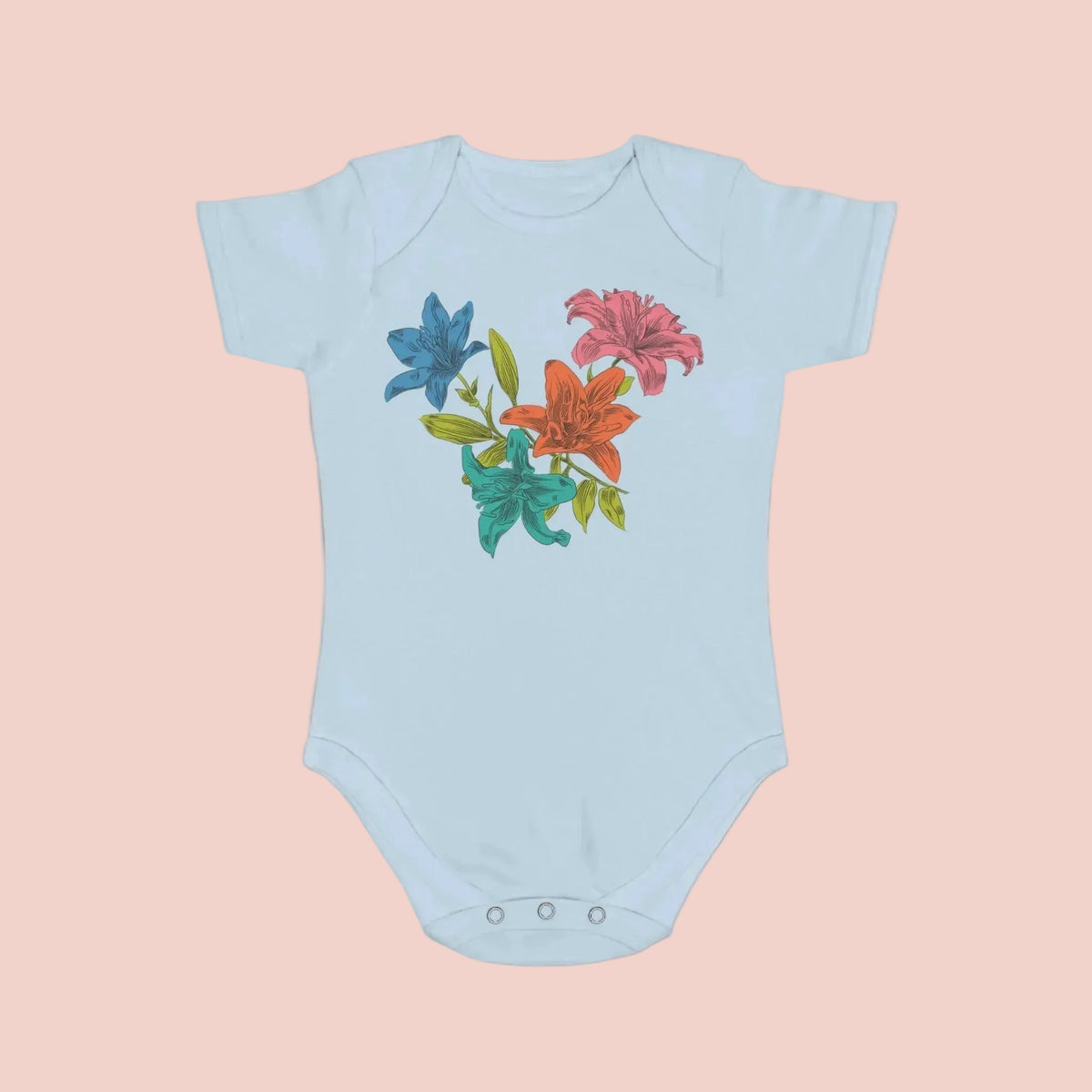 Light blue baby onesie with colorful floral design on a pale background