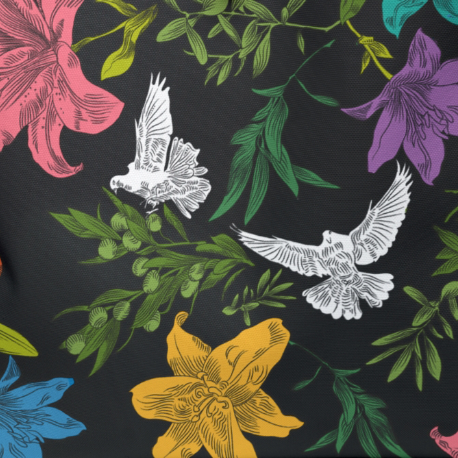 A close-up of the multi-colored dove, lily, and olive branch pattern against the black background. The subtle woven pattern of the canvas fabric can be seen.