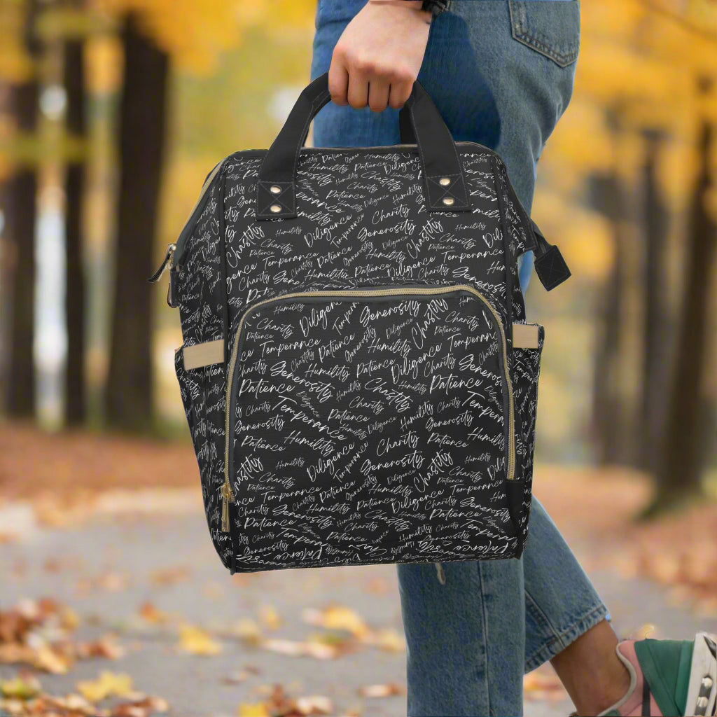 Person carrying a black and white backpack by top handles