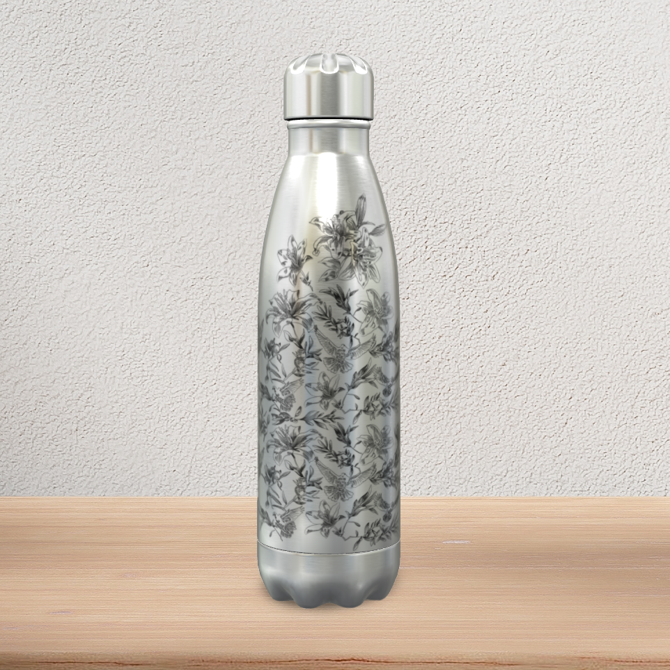 A stainless steel water bottle with stainless steel screw cap stands on a pine-wood console. It displays a black floral and dove pattern on the front.