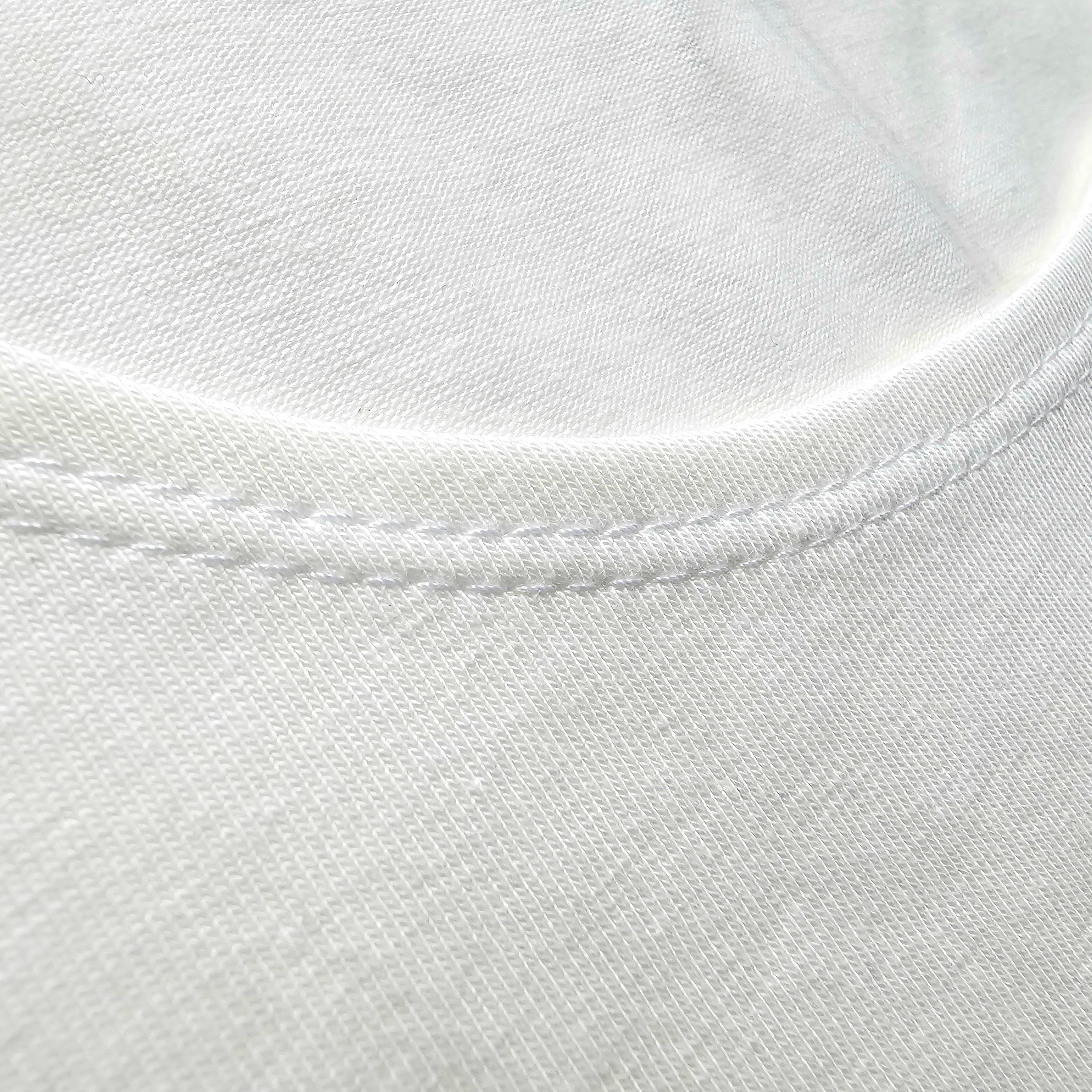 Close-up of a white shirt with a focus on stitching detail