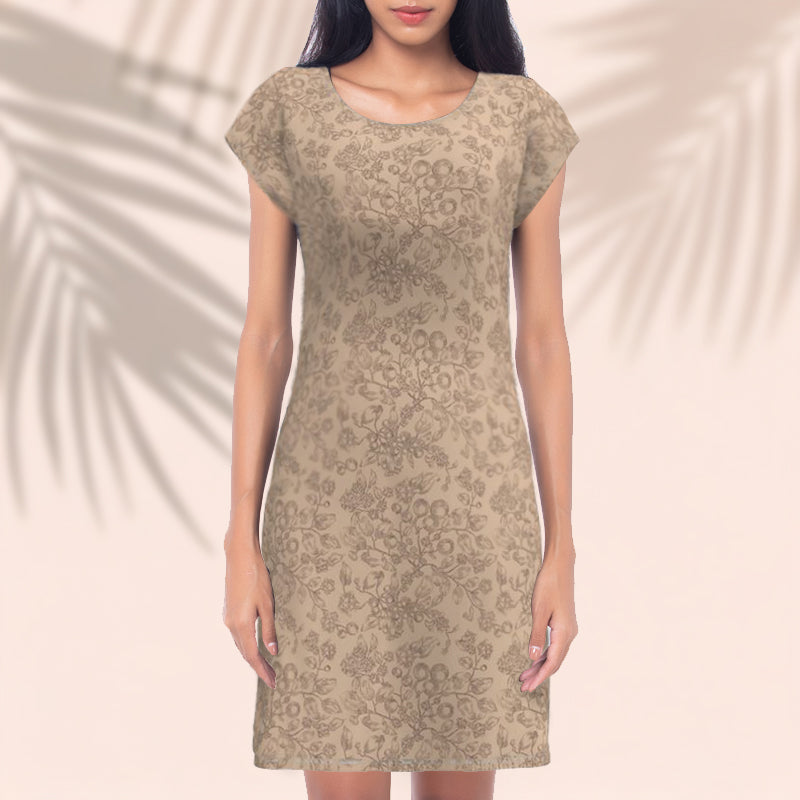 Woman wearing a patterned dress against a neutral background